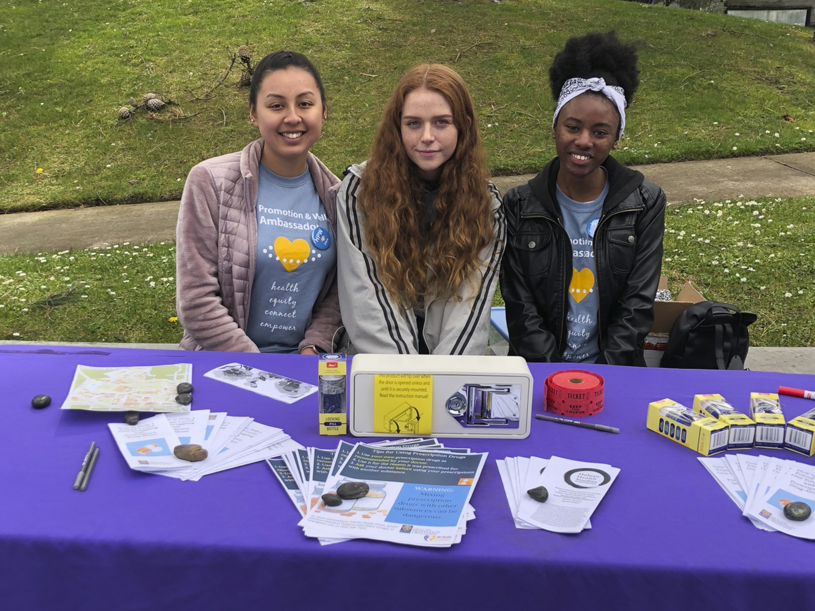 Three Students Tabling an Event